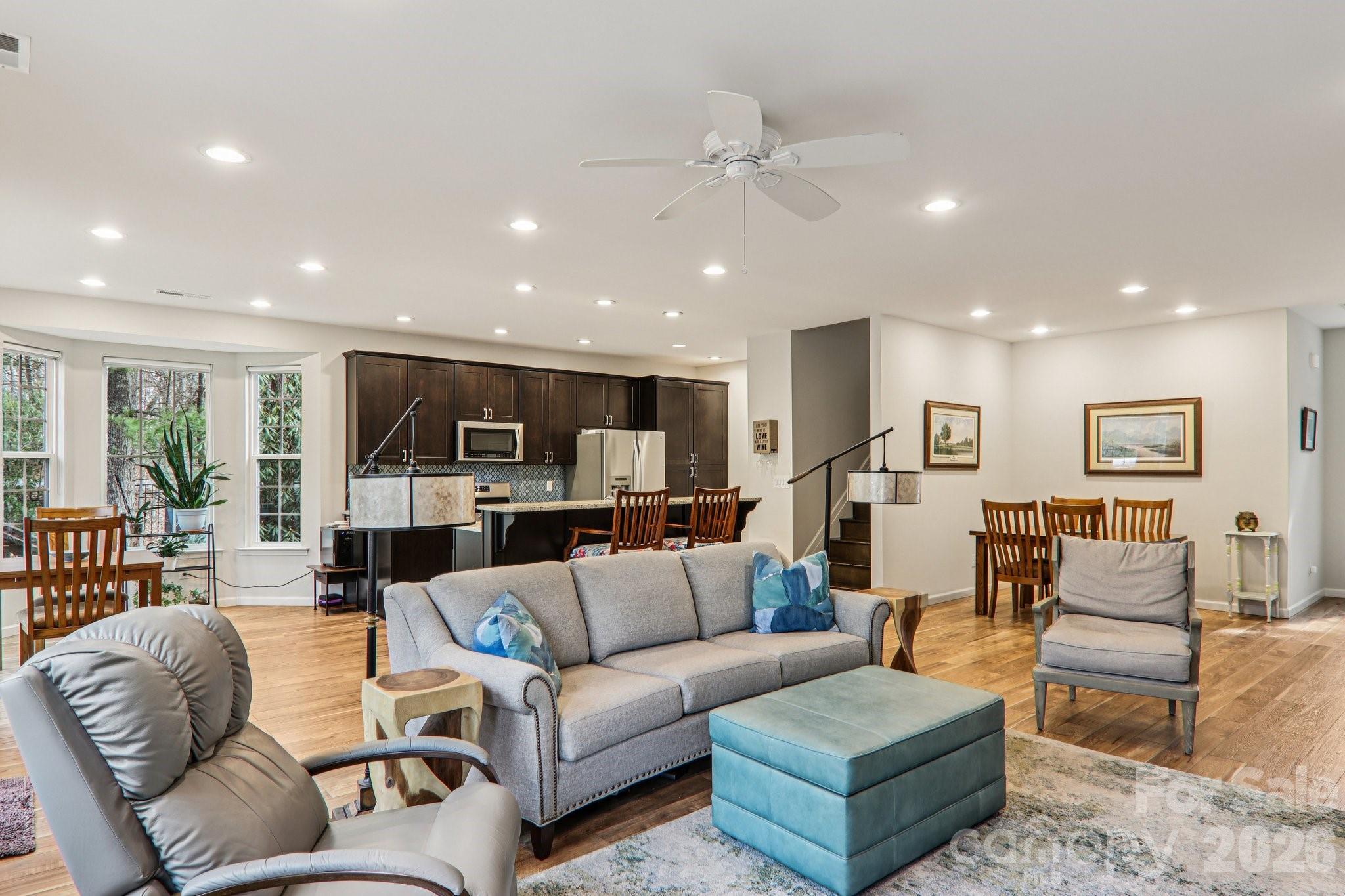 29 Saddle Top Road Flat Rock, NC 28731 - Photo 7 of 46 a living room with furniture kitchen view and a wooden floor