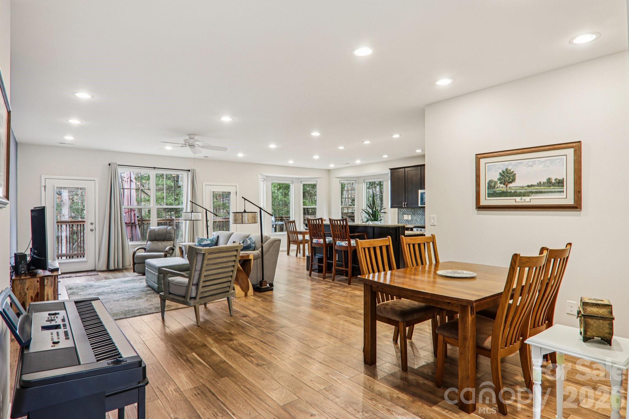 29 Saddle Top Road Flat Rock, NC 28731 - Photo 8 of 46 a living room with furniture a dining table and a flat screen tv