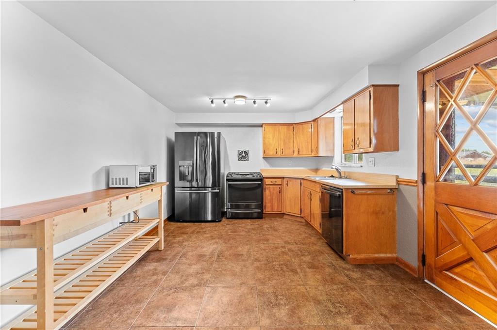 409 4th Street McDonald, PA 15057 - Photo 13 of 37 a kitchen with white cabinets and white appliances