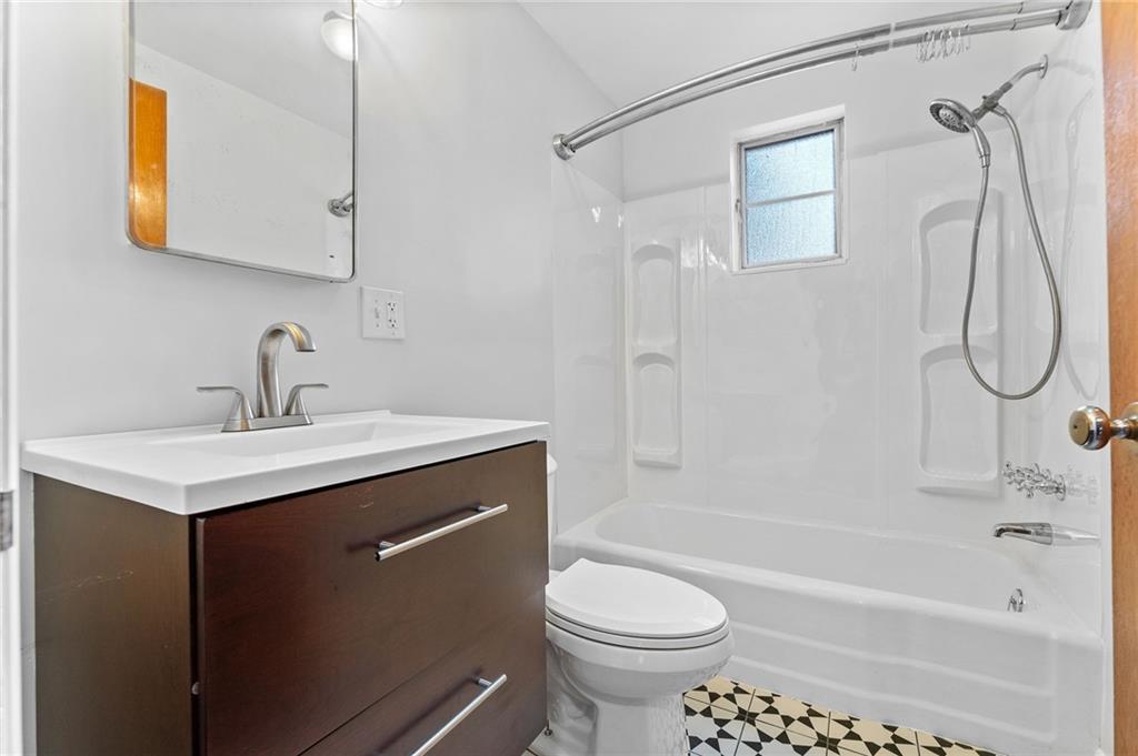 409 4th Street McDonald, PA 15057 - Photo 16 of 37 a bathroom with a sink a toilet and a bathtub