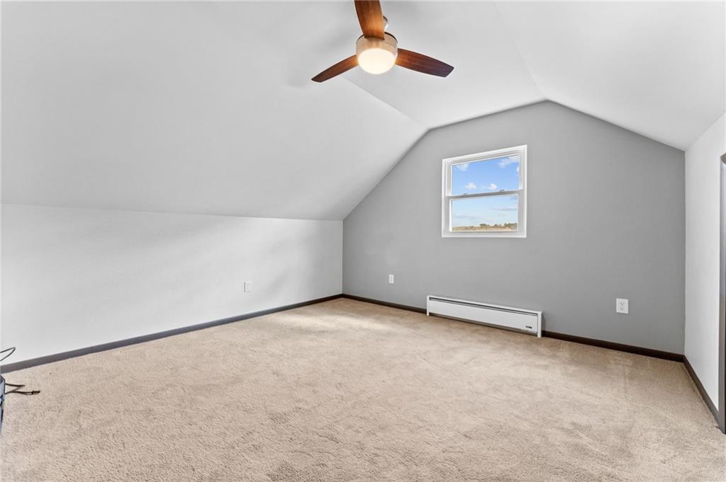 409 4th Street McDonald, PA 15057 - Photo 20 of 37 an empty room with a ceiling fan and a window