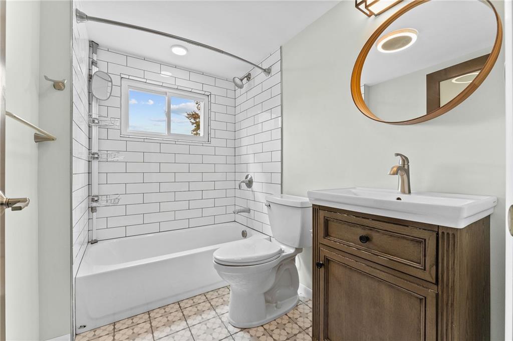 409 4th Street McDonald, PA 15057 - Photo 22 of 37 a bathroom with a sink toilet and shower