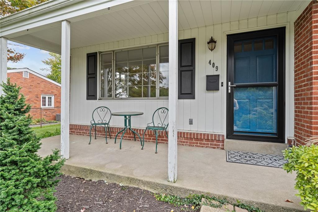 409 4th Street McDonald, PA 15057 - Photo 3 of 37 a view of a patio with table and chairs and potted plants