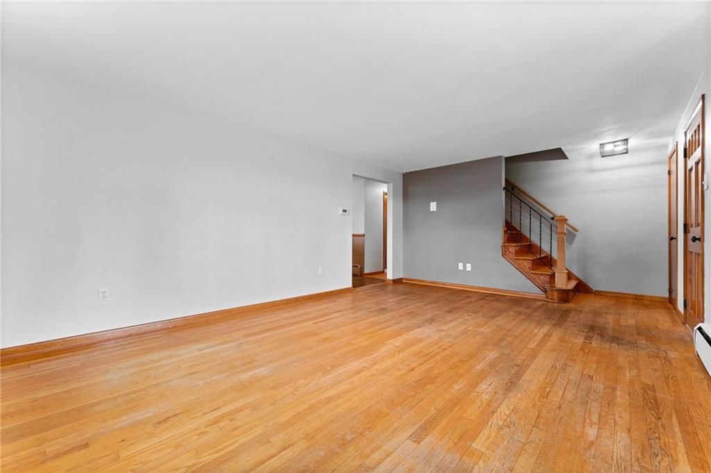 409 4th Street McDonald, PA 15057 - Photo 7 of 37 a view of an empty room with wooden floor