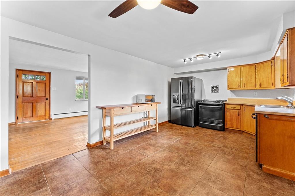 409 4th Street McDonald, PA 15057 - Photo 8 of 37 a kitchen with stainless steel appliances a stove sink and cabinets