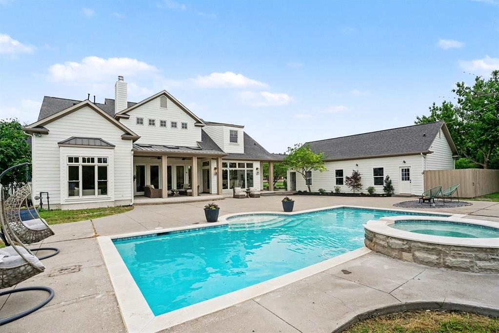 3923 Ranch Estates Circle Plano, TX 75074 - Photo 6 of 32 a view of a house with swimming pool and a yard
