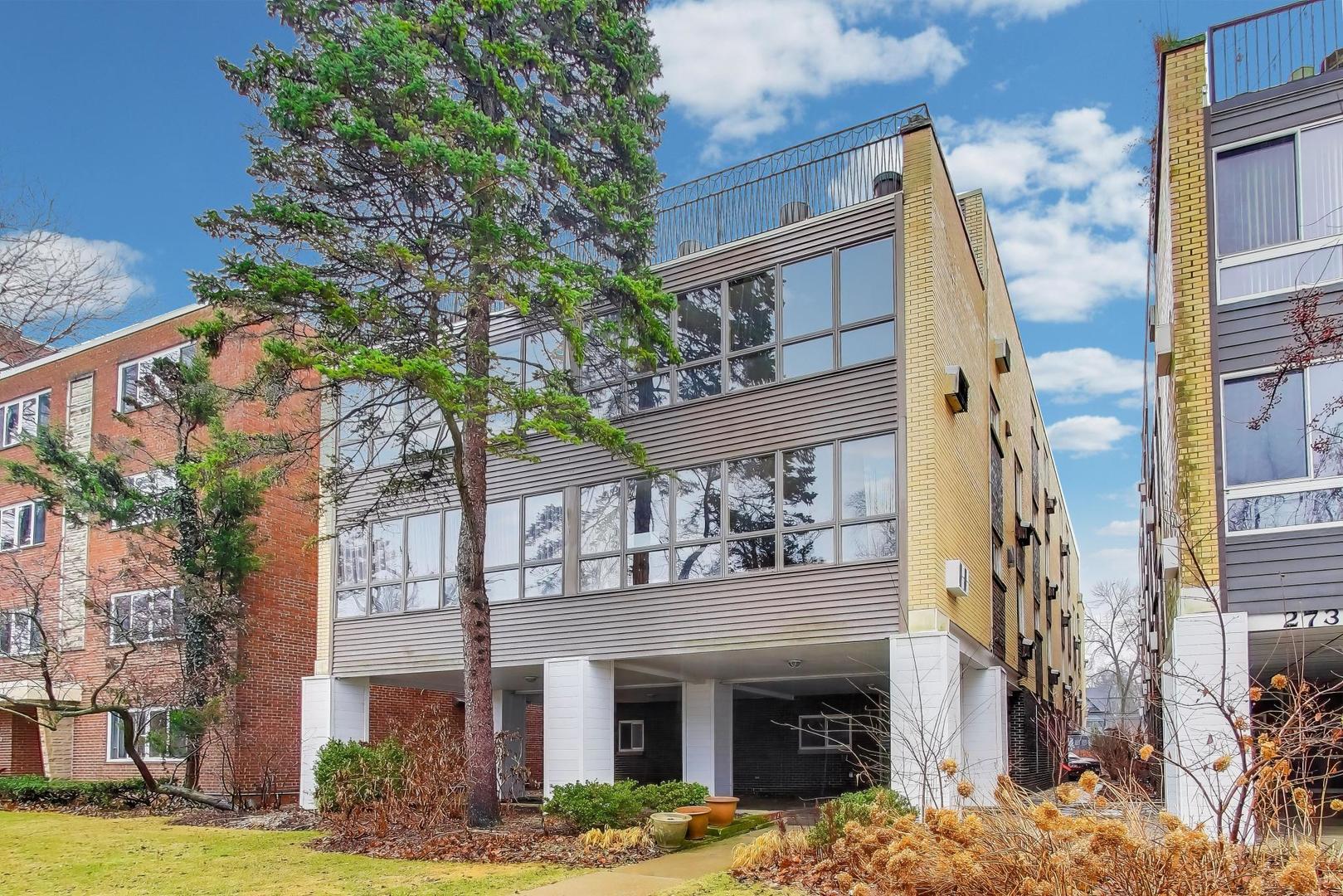 a view of a building with a tree