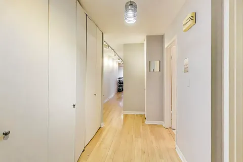 a view of a bathroom from a hallway