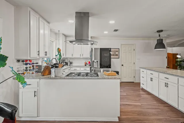 a bedroom with furniture and a flat screen tv