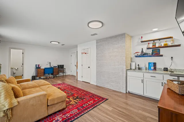 a bathroom with a double vanity sink and a mirror