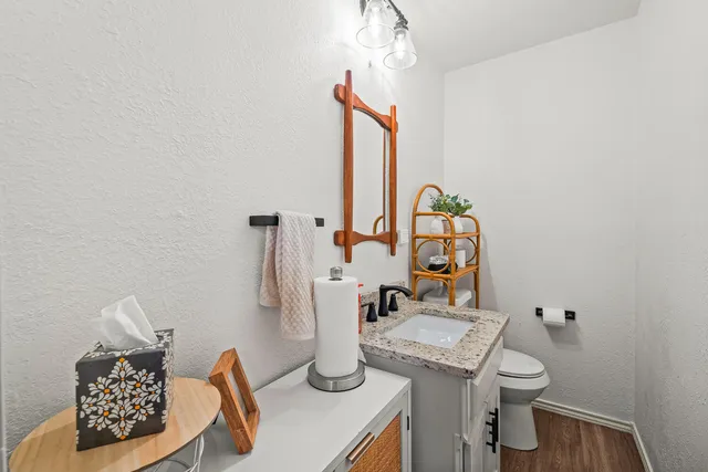 a bed room with a bed and a chair