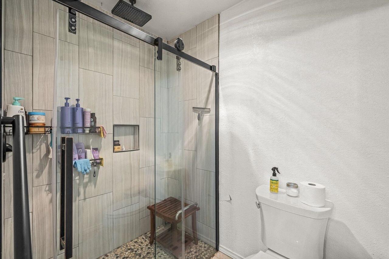 3410 94th Street Lubbock, TX 79423 - Photo 35 of 57 a bathroom with a sink toilet and shower