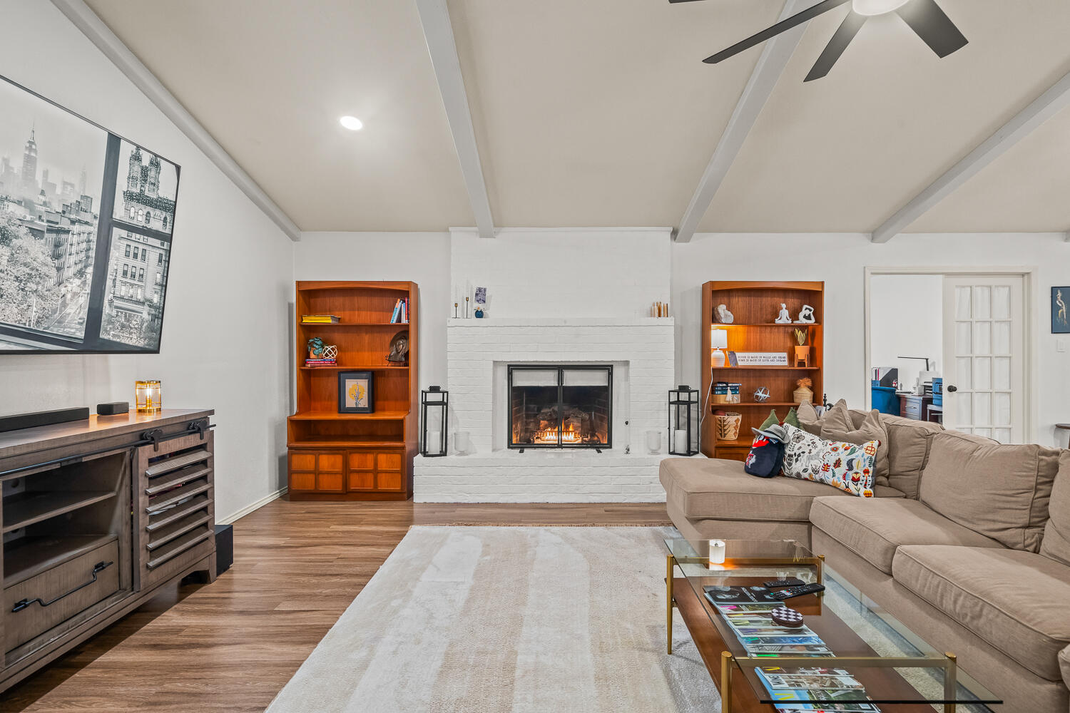 3410 94th Street Lubbock, TX 79423 - Photo 9 of 57 a living room with furniture and a fireplace