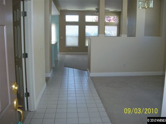 9525 Apache Rose Drive Reno, NV 89521 - Photo 3 of 13 a view of hallway with a window
