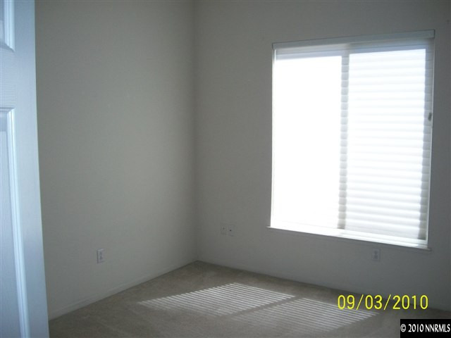9525 Apache Rose Drive Reno, NV 89521 - Photo 9 of 13 a view of an empty room with a window