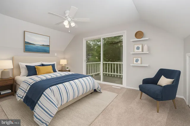 a bed room with a bed and a chair