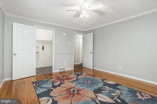 a bedroom with a bed and a table in it