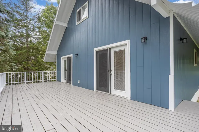 a view of backyard with a deck