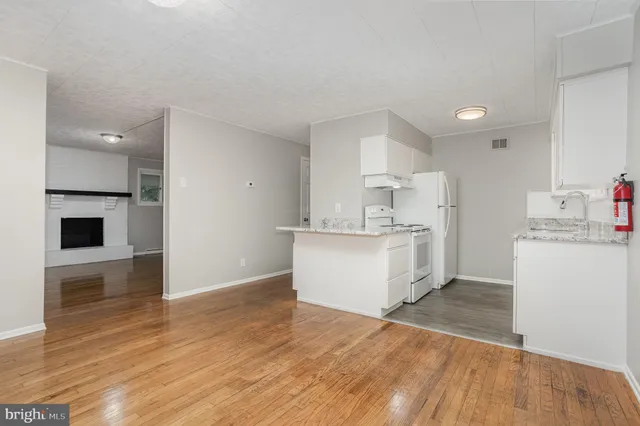 a view of kitchen with wooden floor