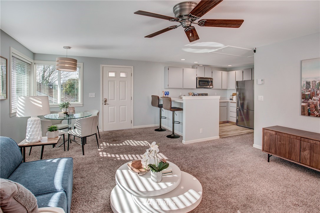 2400 East Howell Street, Unit E Seattle, WA 98122 - Photo 12 of 39 a living room with furniture and a dining table