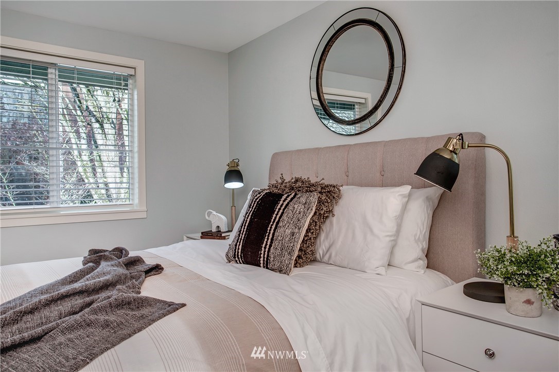 2400 East Howell Street, Unit E Seattle, WA 98122 - Photo 16 of 39 a bedroom with a bed and a large window