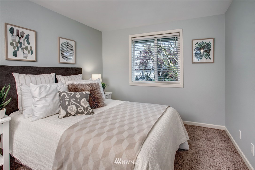 2400 East Howell Street, Unit E Seattle, WA 98122 - Photo 20 of 39 a bedroom with bed and a window