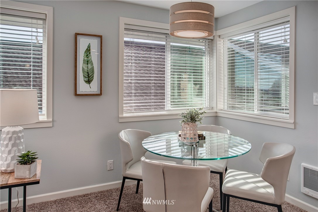 2400 East Howell Street, Unit E Seattle, WA 98122 - Photo 3 of 39 a dining room with furniture and windows