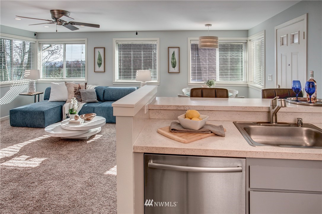 2400 East Howell Street, Unit E Seattle, WA 98122 - Photo 22 of 39 a kitchen with a sink and living room