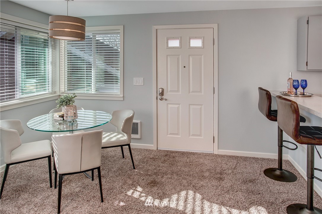 2400 East Howell Street, Unit E Seattle, WA 98122 - Photo 25 of 39 a dining room with furniture and window