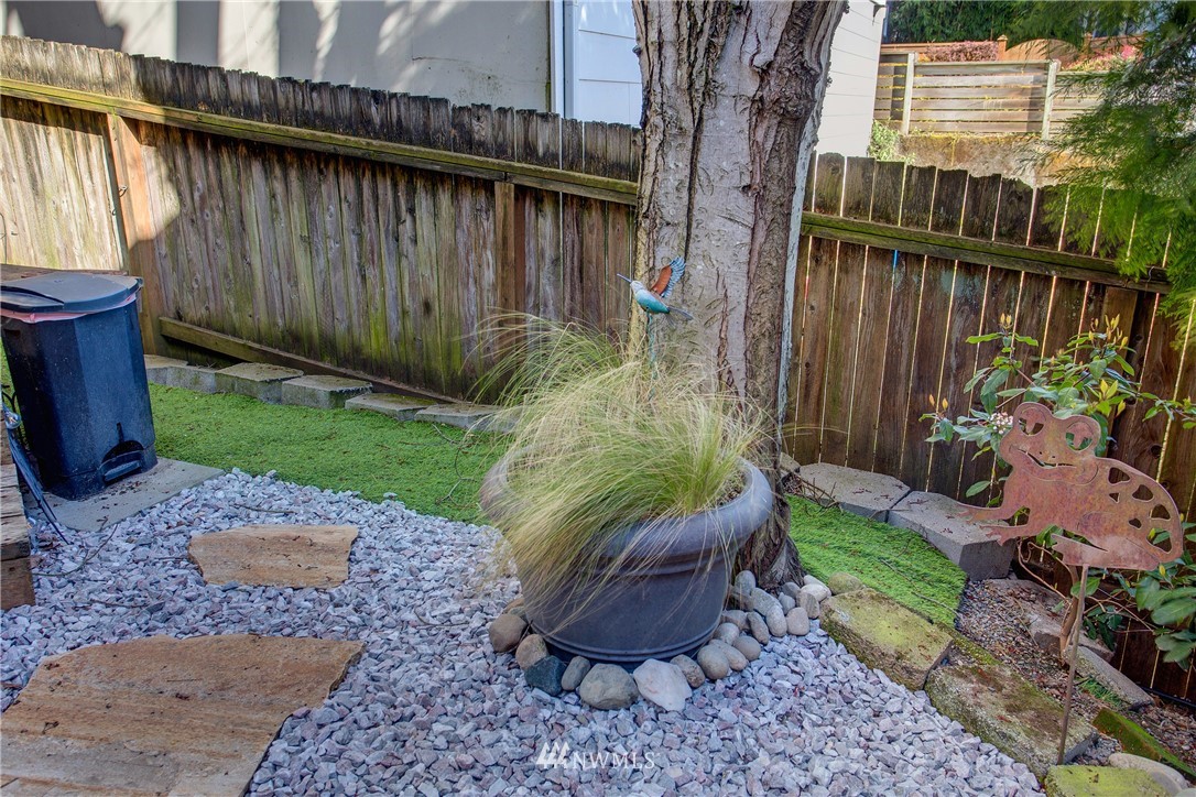 2400 East Howell Street, Unit E Seattle, WA 98122 - Photo 28 of 39 a view of a backyard with furniture and garden