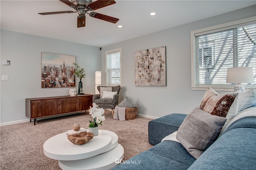 2400 East Howell Street, Unit E Seattle, WA 98122 - Photo 8 of 39 a living room with furniture and a wooden floor