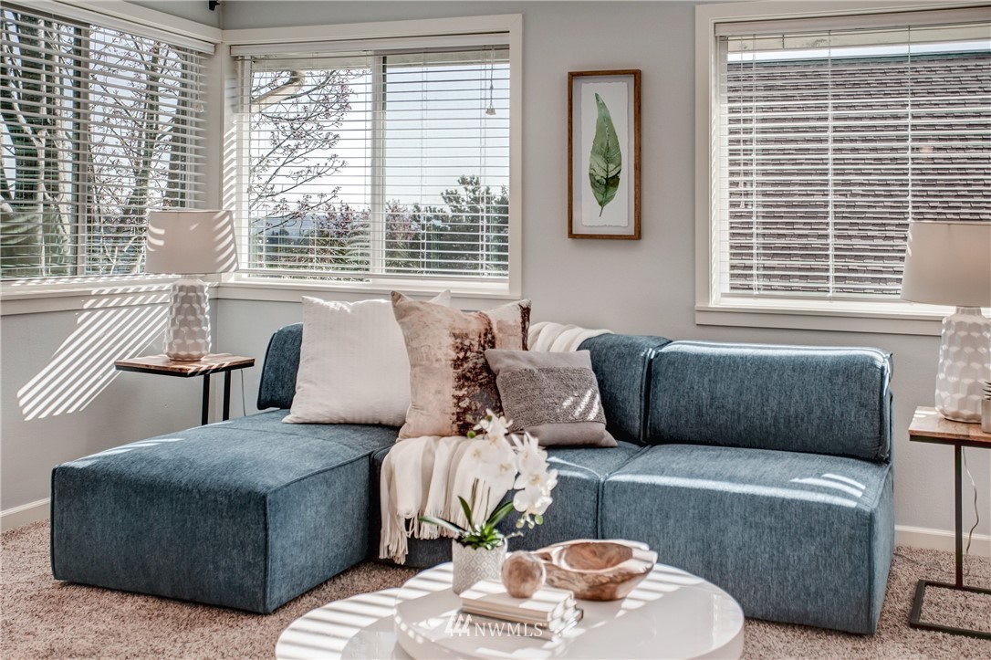 2400 East Howell Street, Unit E Seattle, WA 98122 - Photo 9 of 39 a living room with furniture and a large window