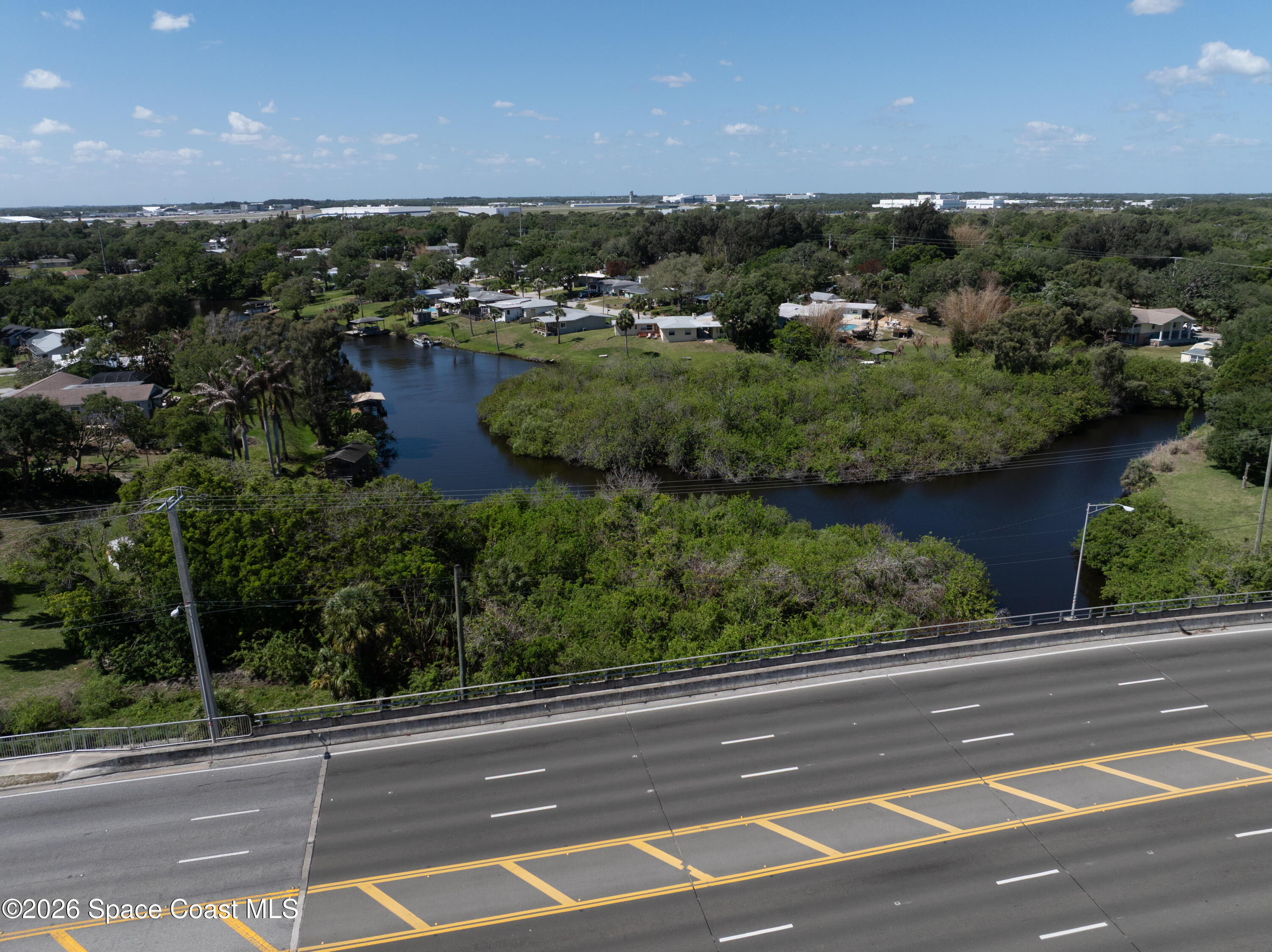 684 Rear N Harbor Drive Melbourne, FL 32935 - Photo 1 of 11 an aerial view of residential houses with outdoor space and lake view