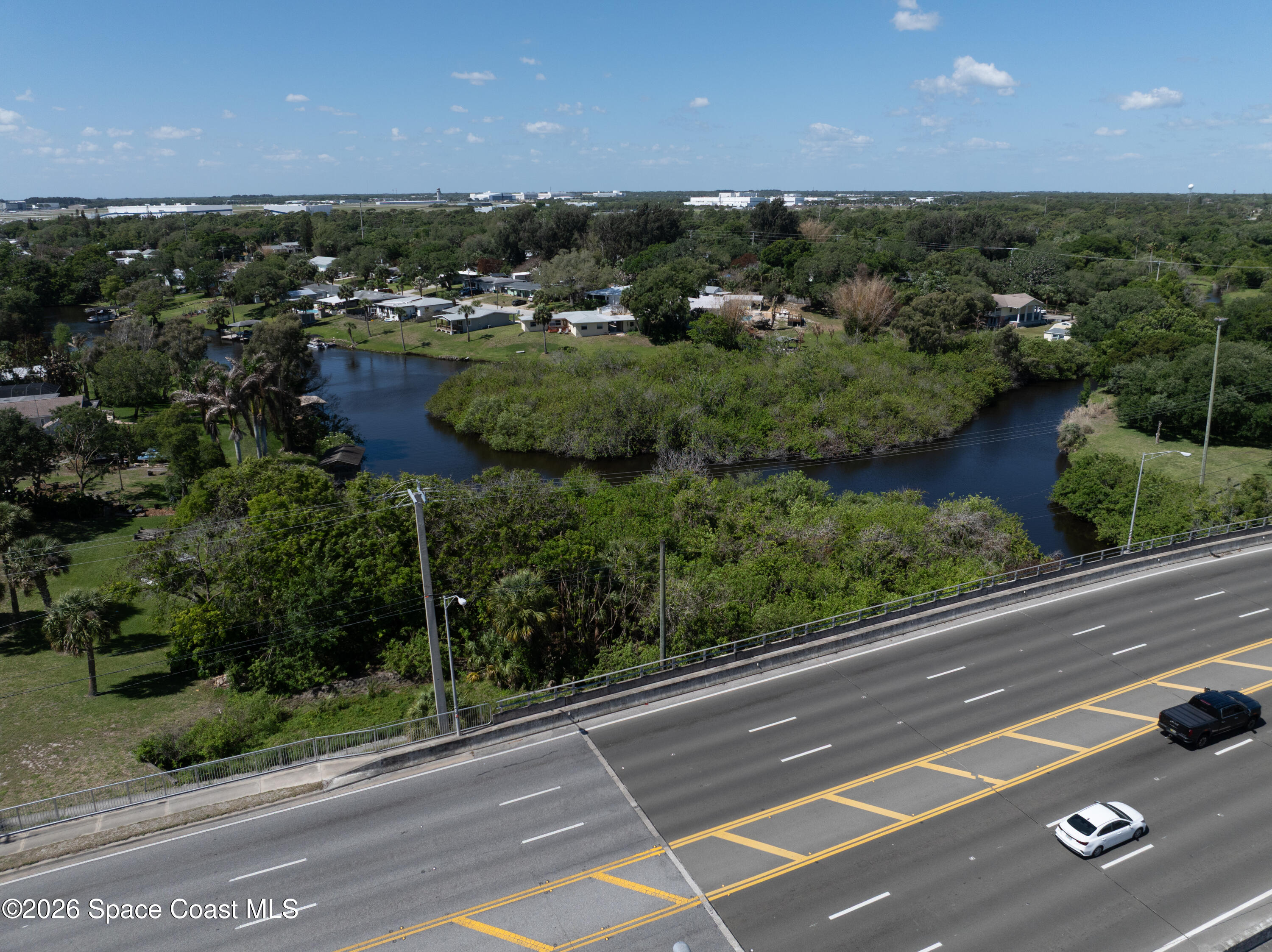 684 Rear N Harbor Drive Melbourne, FL 32935 - Photo 2 of 11 a view of a city street with a lot of trees