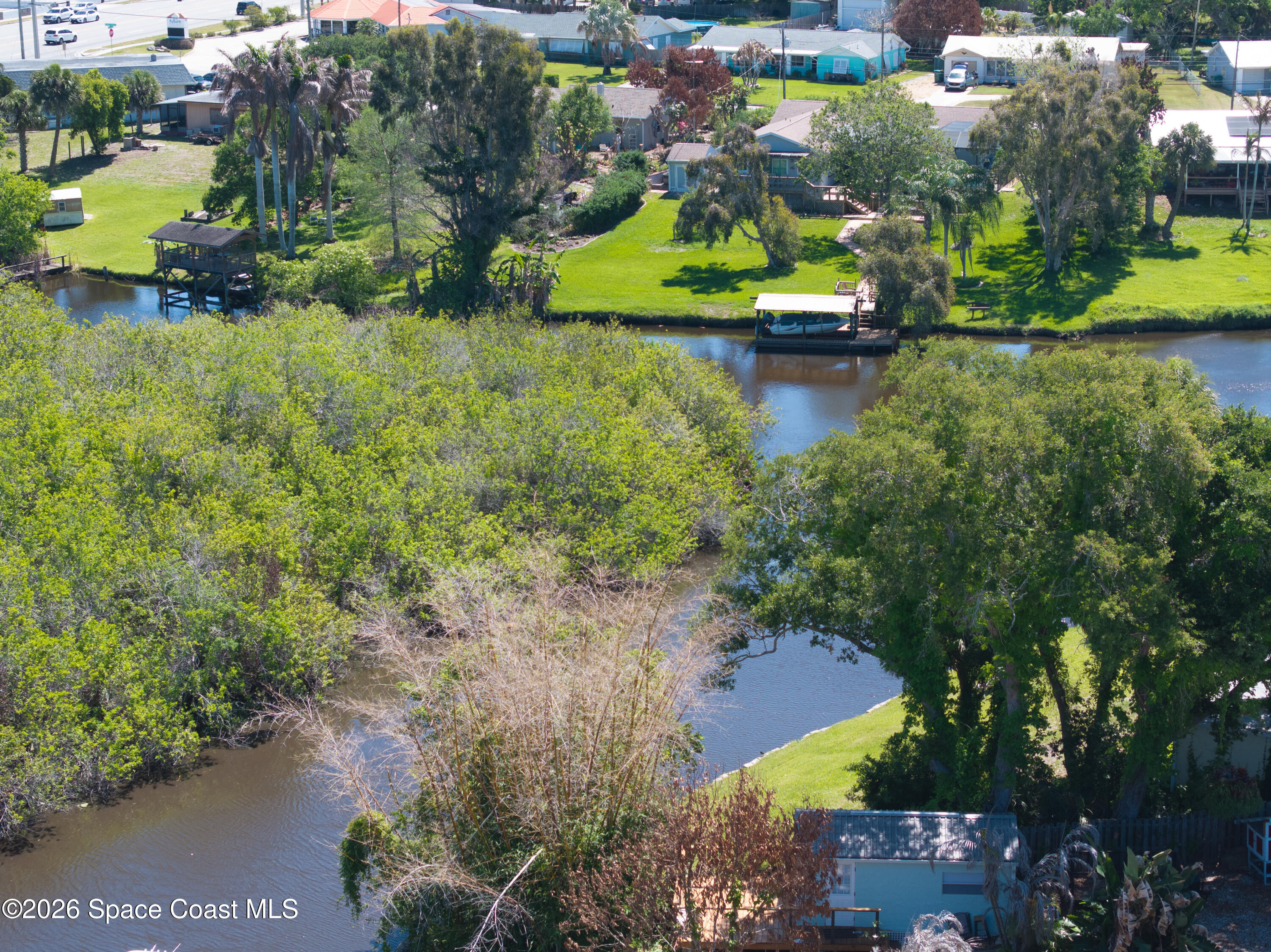 684 Rear N Harbor Drive Melbourne, FL 32935 - Photo 10 of 11 an aerial view of a house with a yard and lake view