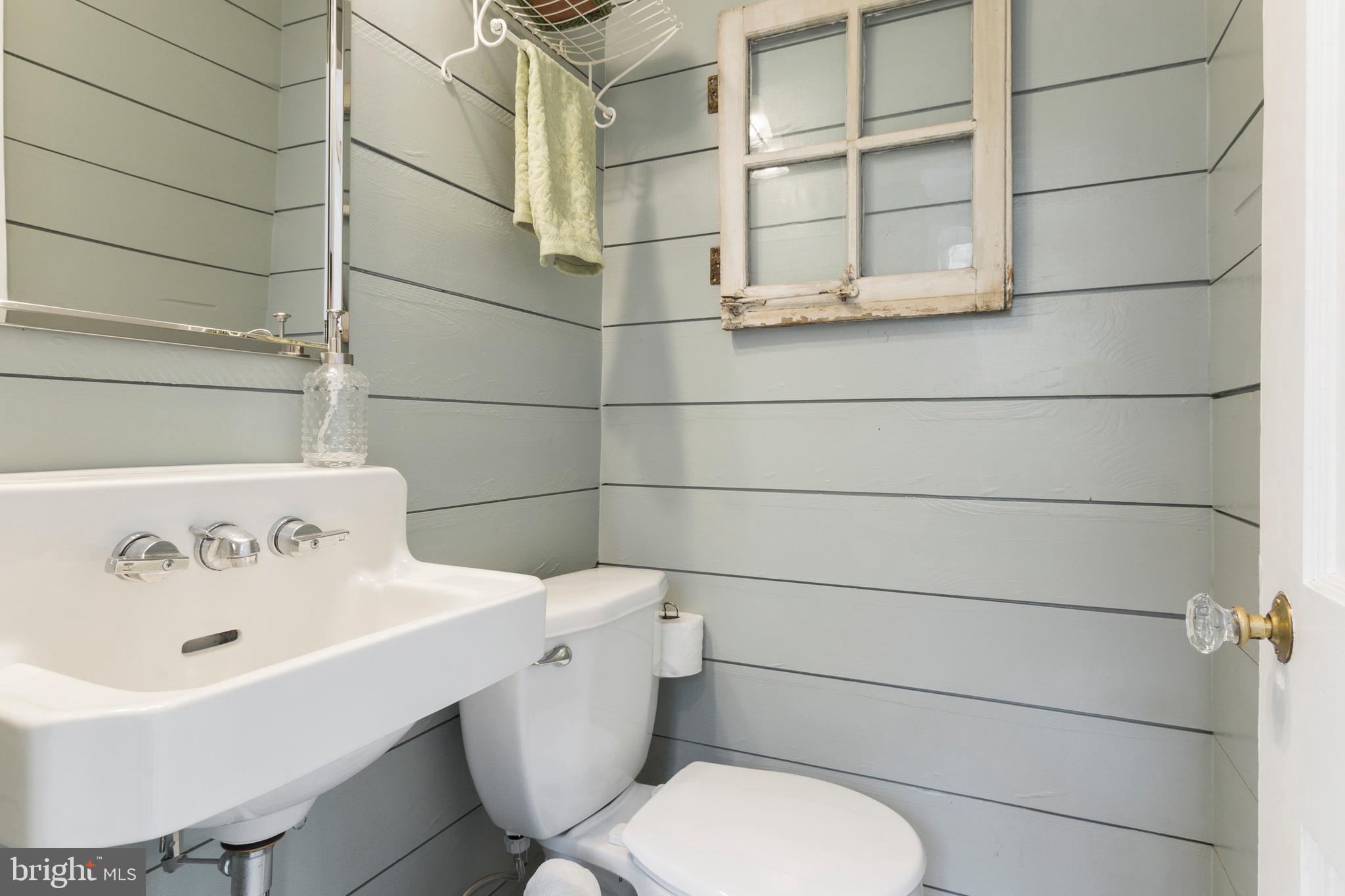 205 Laurel Road Linthicum Heights, MD 21090 - Photo 12 of 48 Powder room on main level with cozy shiplap.