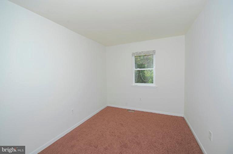 8228 Monaegan Court Severn, MD 21144 - Photo 9 of 9 an empty room with a window