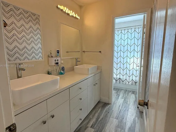 a bedroom with a bed and dresser