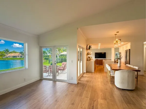 a view of a room with wooden floor and chair