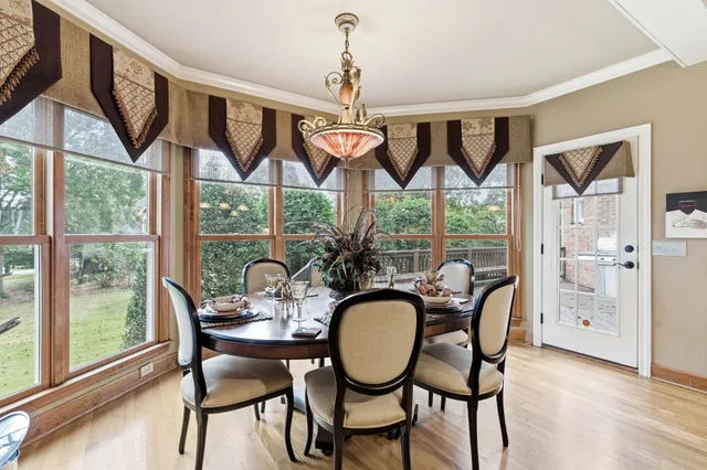 a spacious bedroom with a bed and a chandelier
