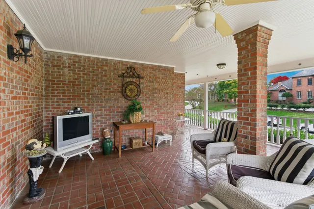 a spacious en suite bathroom with double sink a large mirror and a shower