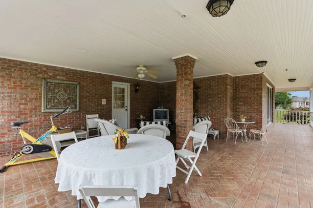 a bathroom with a glass shower door and a window