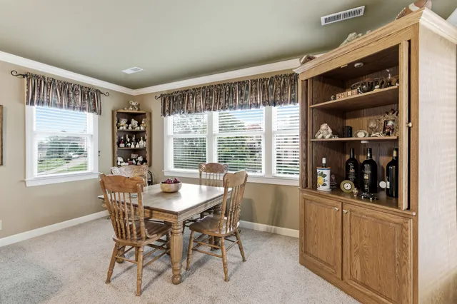 a close view of walk in closet with clothes