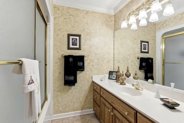 an aerial view of a house with a lake view