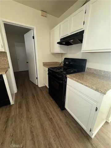 a kitchen with a stove and a microwave