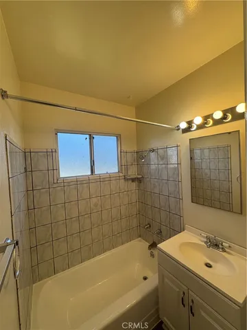 a bathroom with a sink and shower