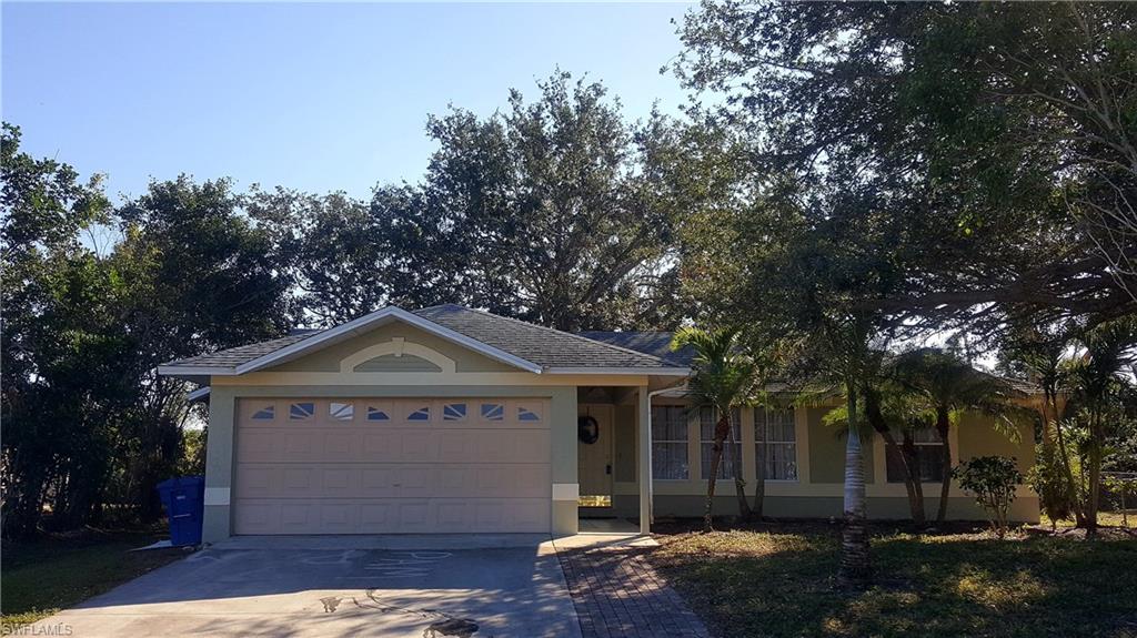 9120 Frank Road Fort Myers, FL 33967 - Photo 1 of 9 a front view of a house with a yard
