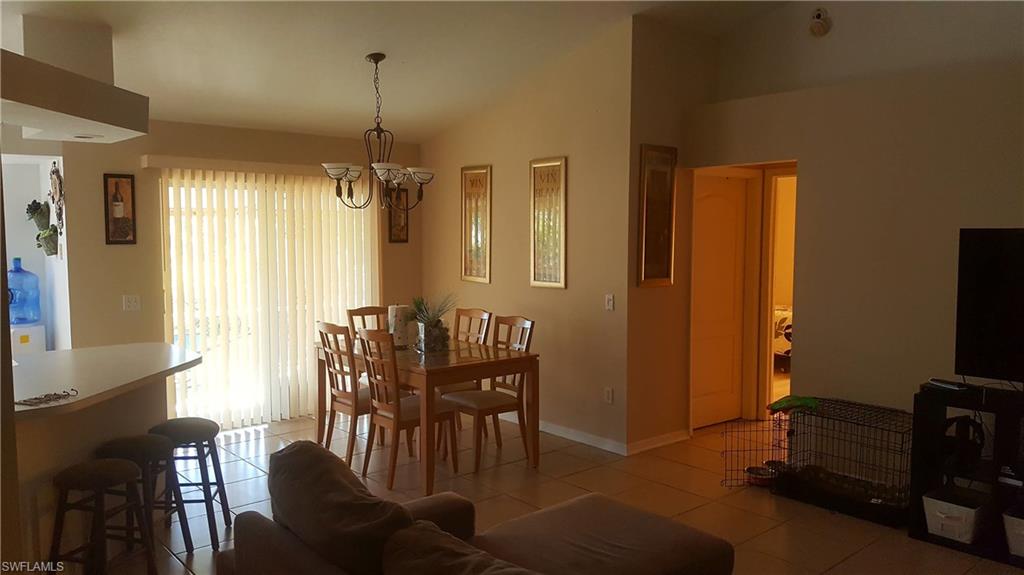 9120 Frank Road Fort Myers, FL 33967 - Photo 3 of 9 a view of a livingroom with furniture window and wooden floor