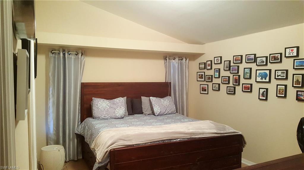 9120 Frank Road Fort Myers, FL 33967 - Photo 5 of 9 a bedroom with a bed and a window