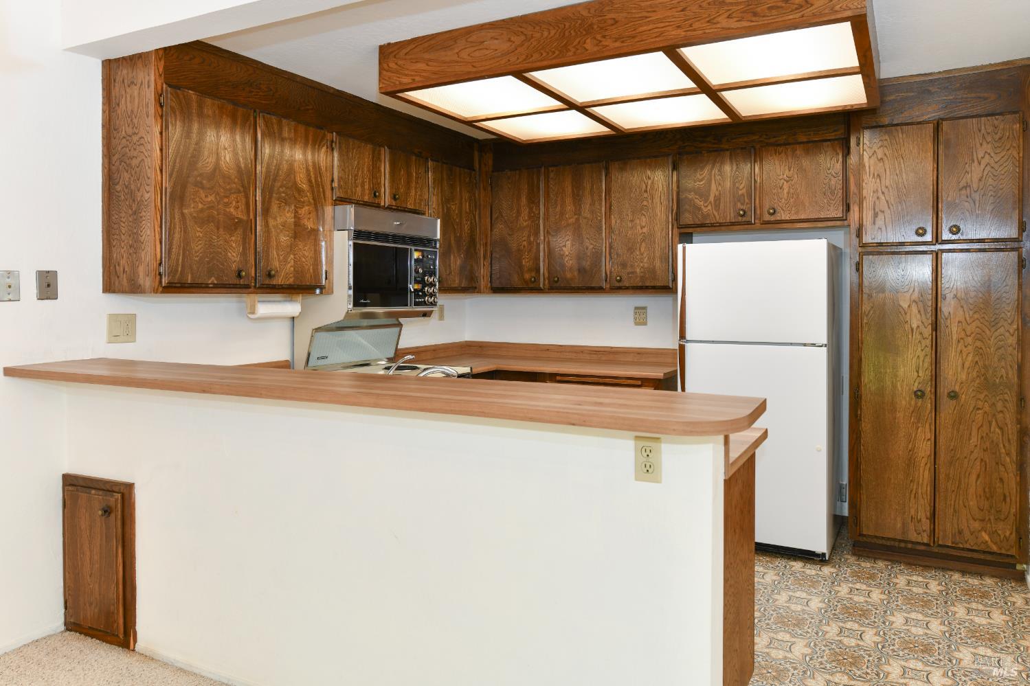 3007 Loma Court Santa Rosa, CA 95405 - Photo 10 of 43 Counter over looks the dining room. Perfect to set up a buffet for dinner parties